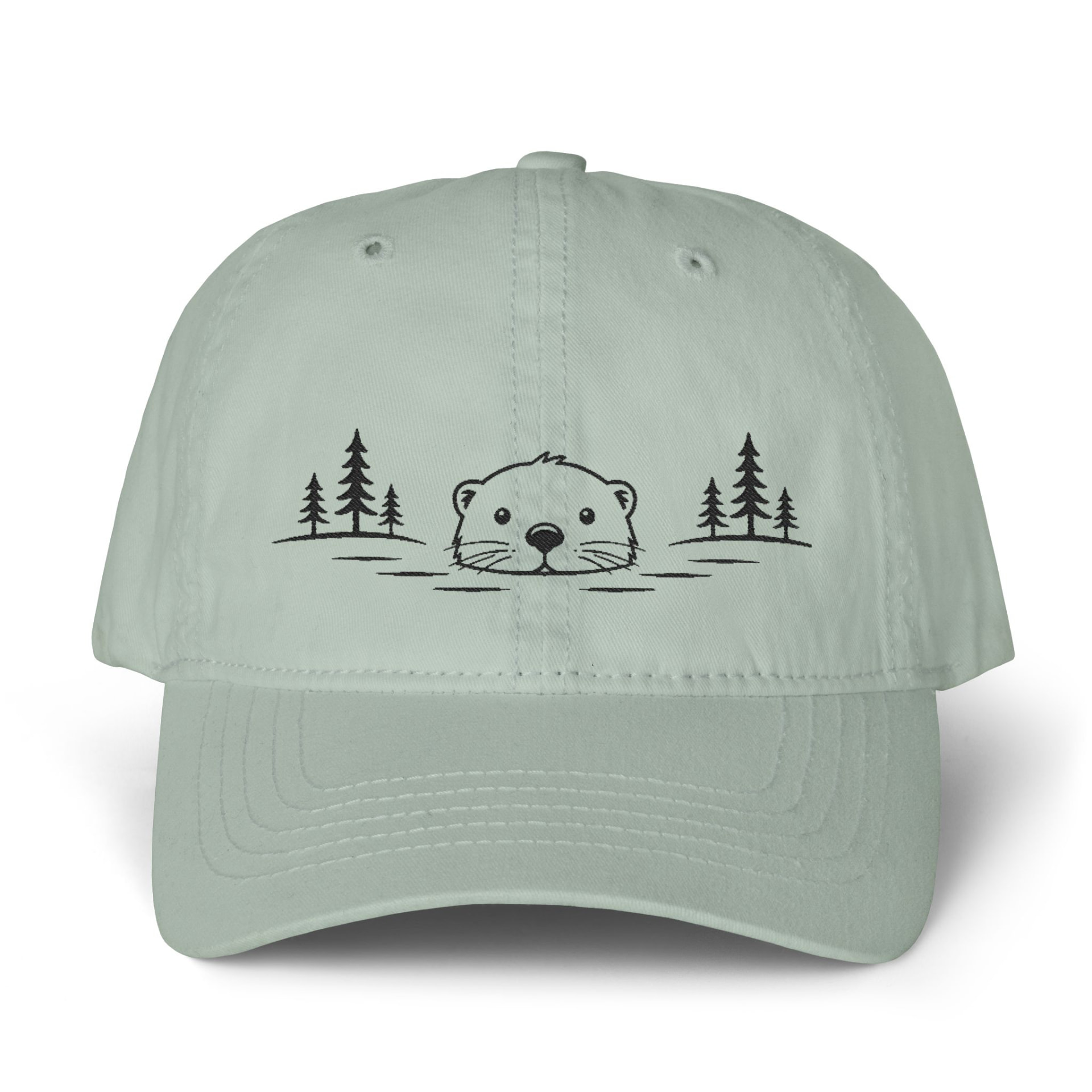 Sage green cotton dad hat with a minimalist black embroidered otter between pine trees