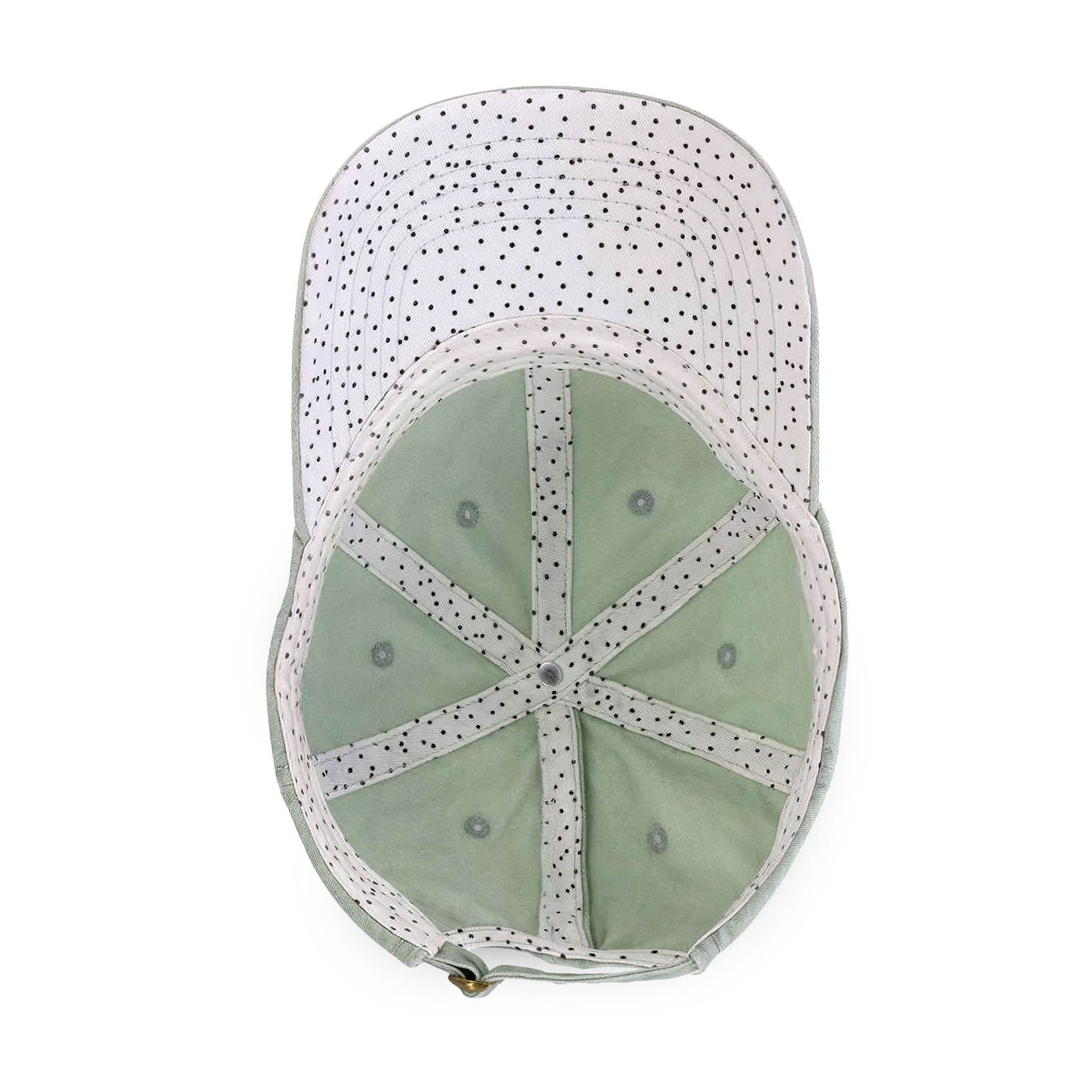 Inside of the sage green cap showing the white polka dot lining and adjustable buckle